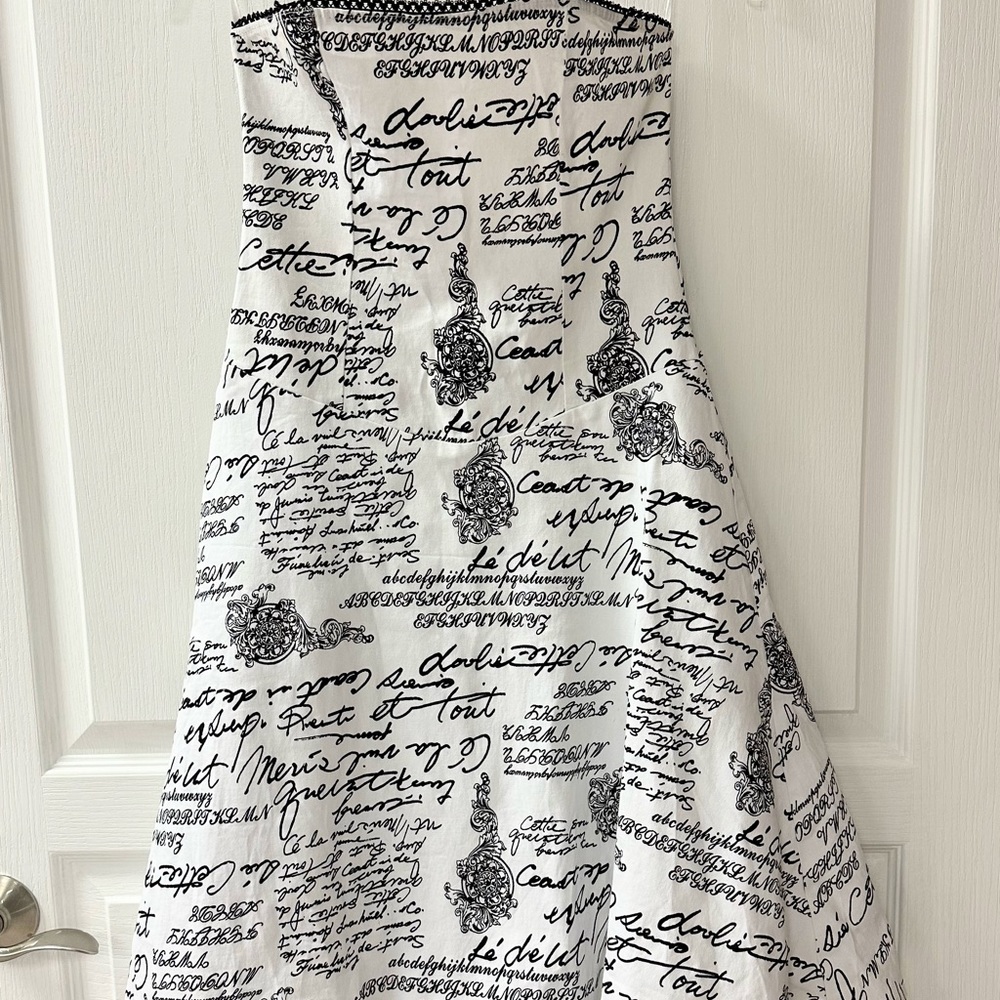 Strapless black and white dress with tulle underneath.